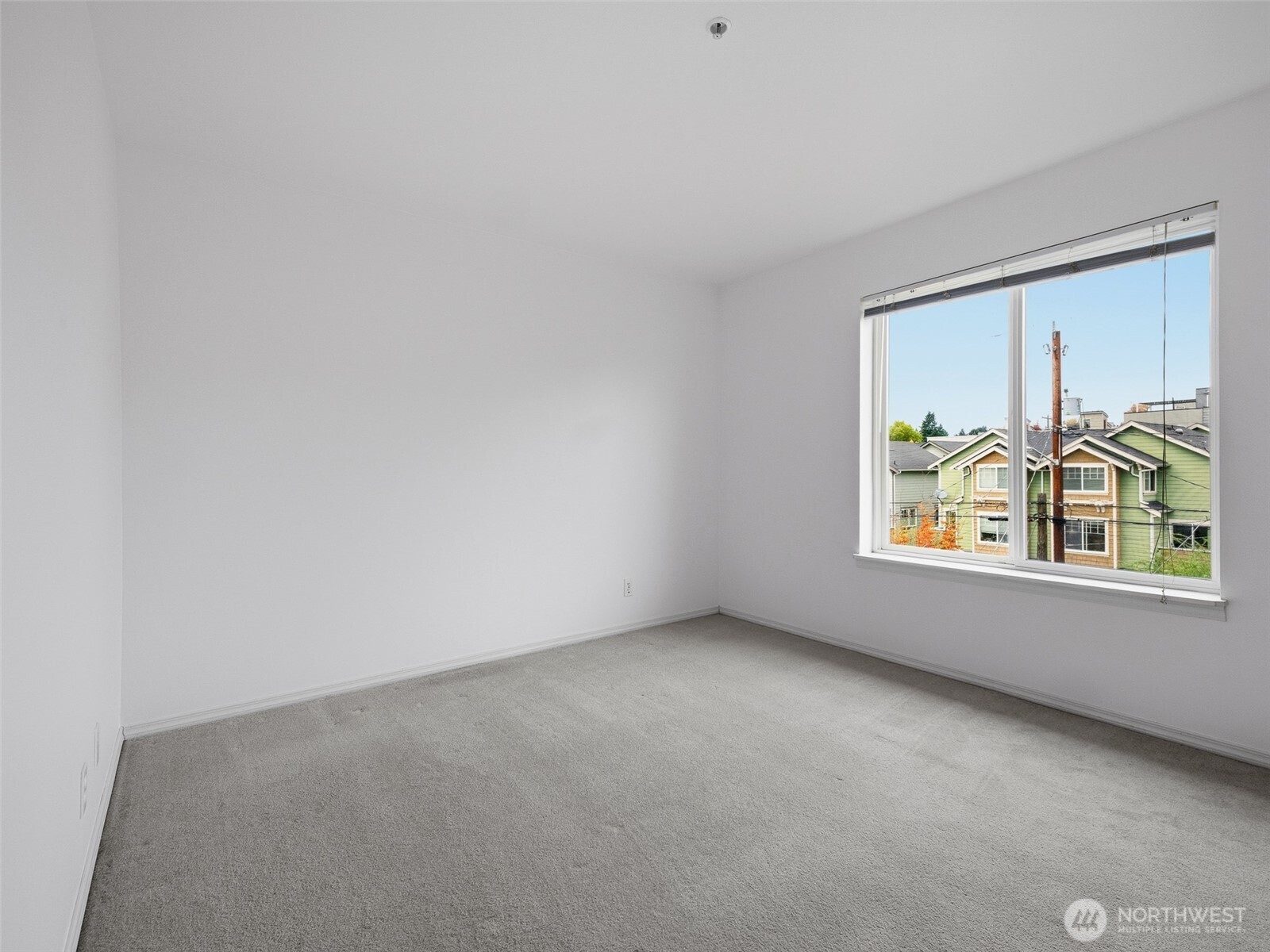 1733 Northwest 59th Street, Unit 301 Seattle, WA 98107 - Photo 30 of 35 an empty room with windows