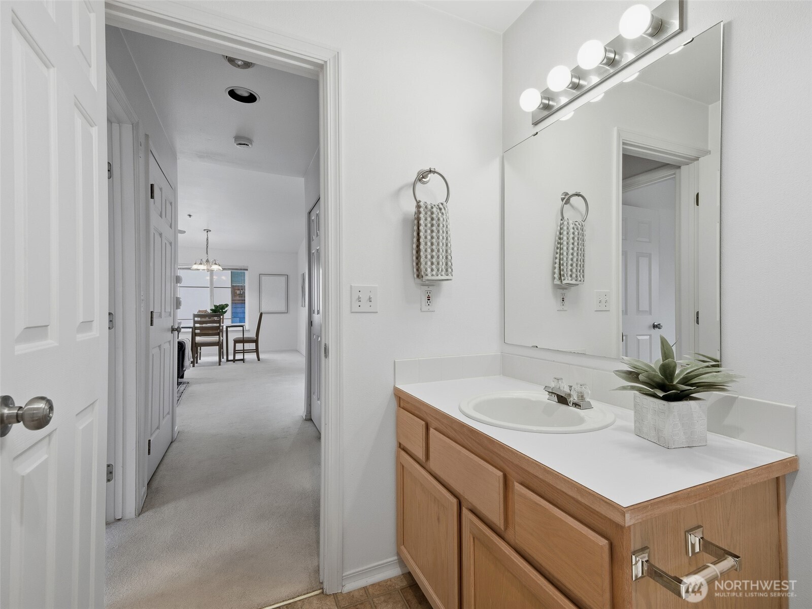 1733 Northwest 59th Street, Unit 301 Seattle, WA 98107 - Photo 32 of 35 a en suite bathroom with a sink double vanity and a mirror