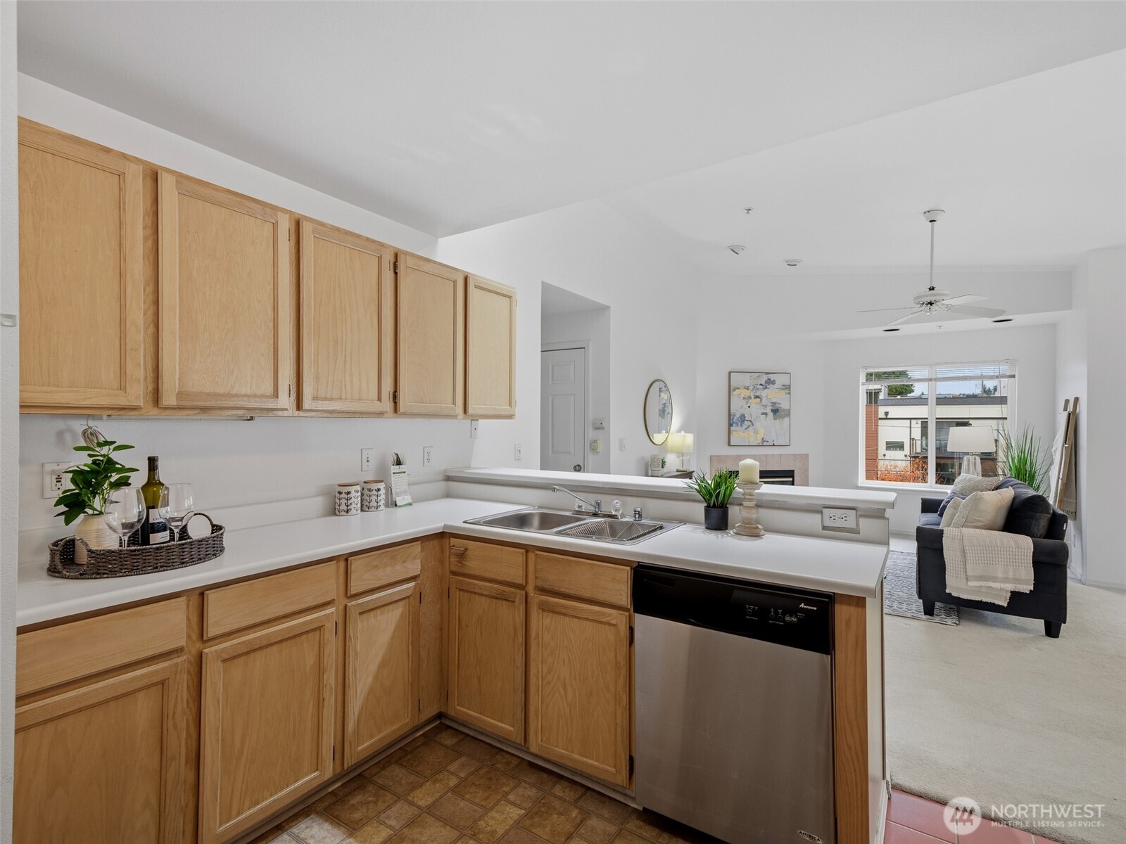1733 Northwest 59th Street, Unit 301 Seattle, WA 98107 - Photo 8 of 35 a kitchen with a sink and cabinets