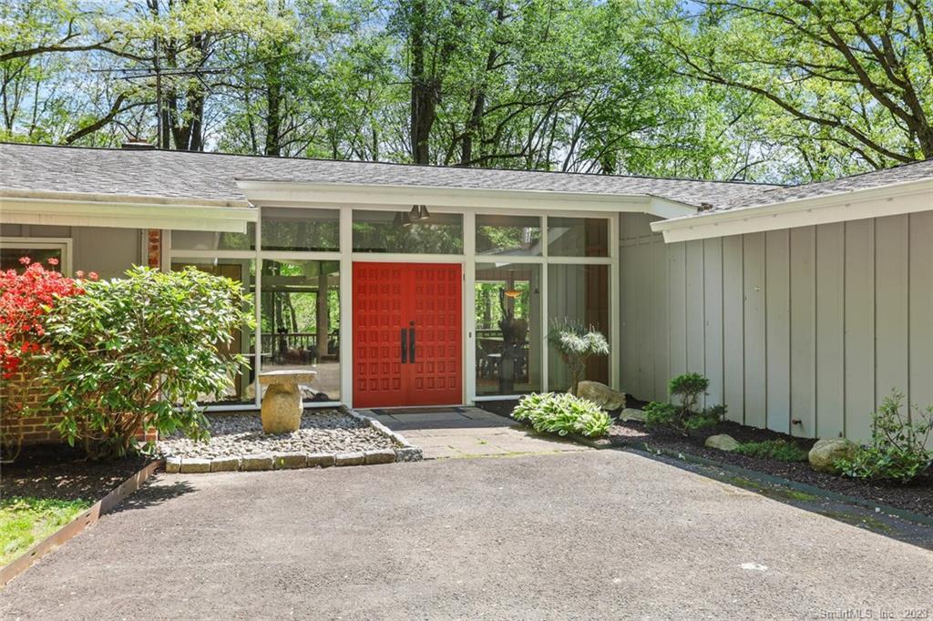 90 Signal Hill Road Wilton, CT 06897 - Photo 1 of 1 a front view of a house with garden