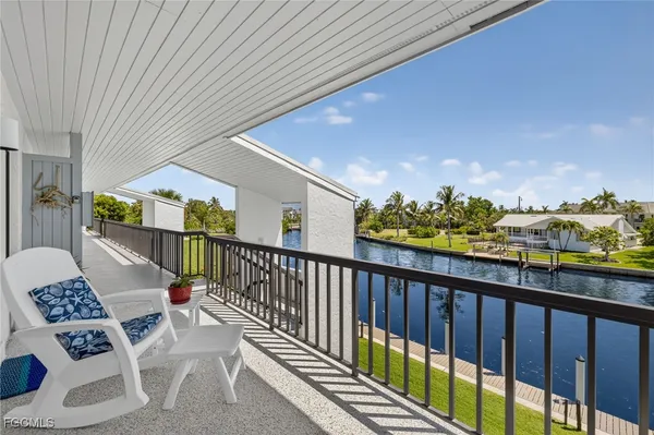 a view of a swimming pool with a chairs