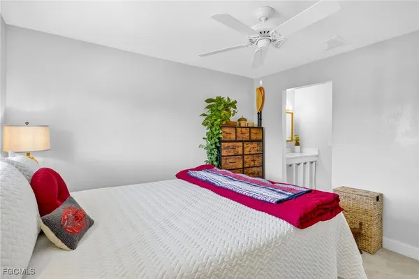 a bedroom with bed and a window