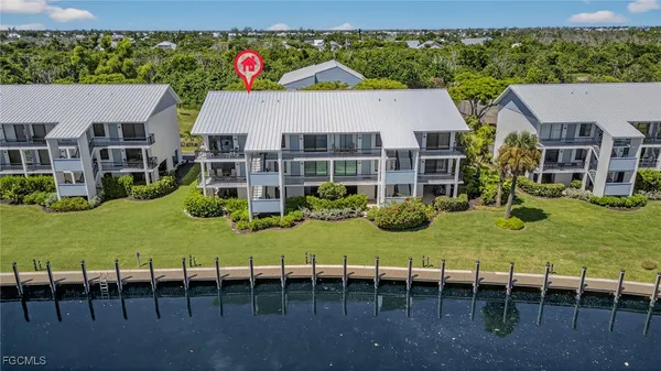 a view of a balcony with wooden floor and city view
