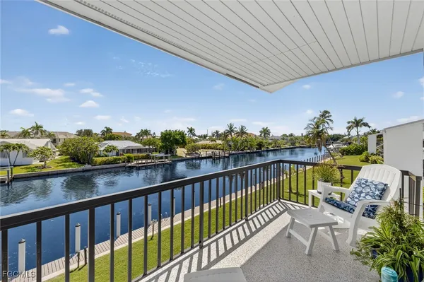 a view of a house with a yard patio and swimming pool