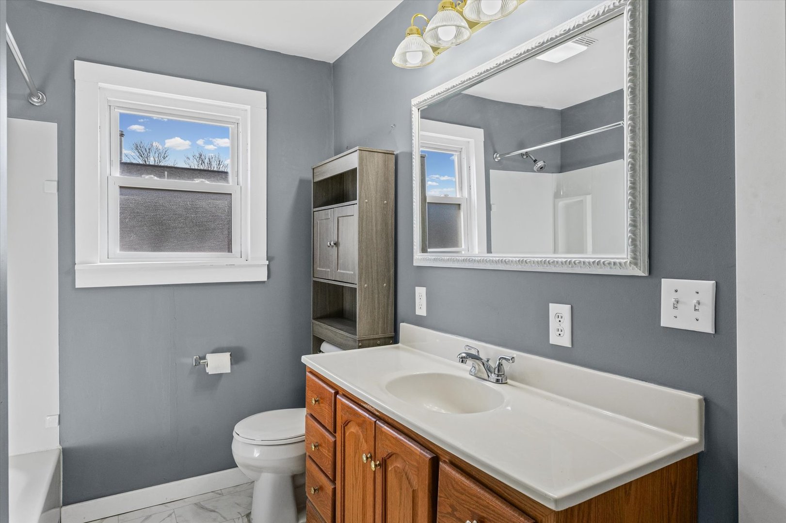 104 Allen Street Allerton, IL 61810 - Photo 18 of 33 a bathroom with a sink and a toilet