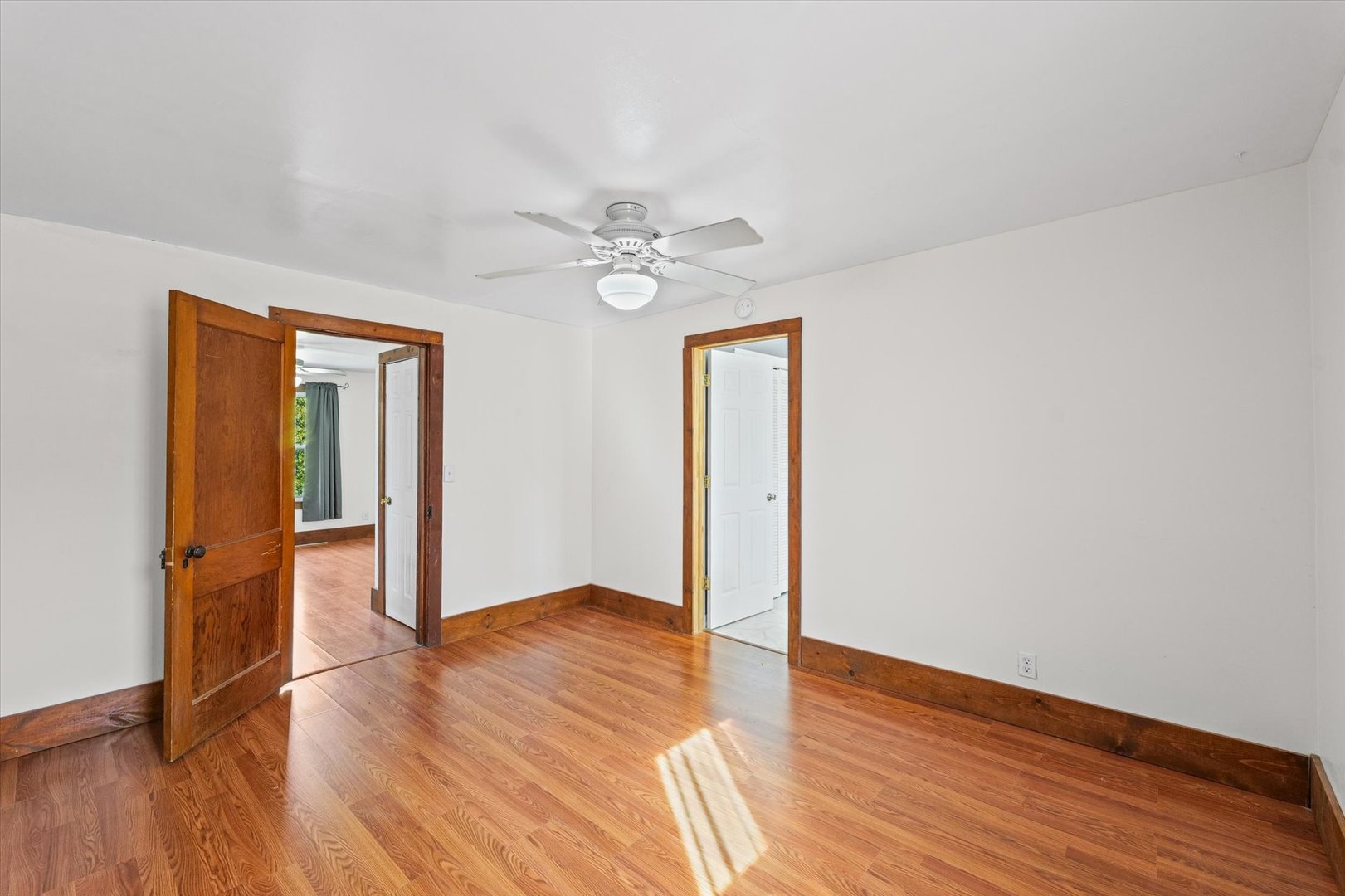 104 Allen Street Allerton, IL 61810 - Photo 21 of 33 an empty room with wooden floor and window