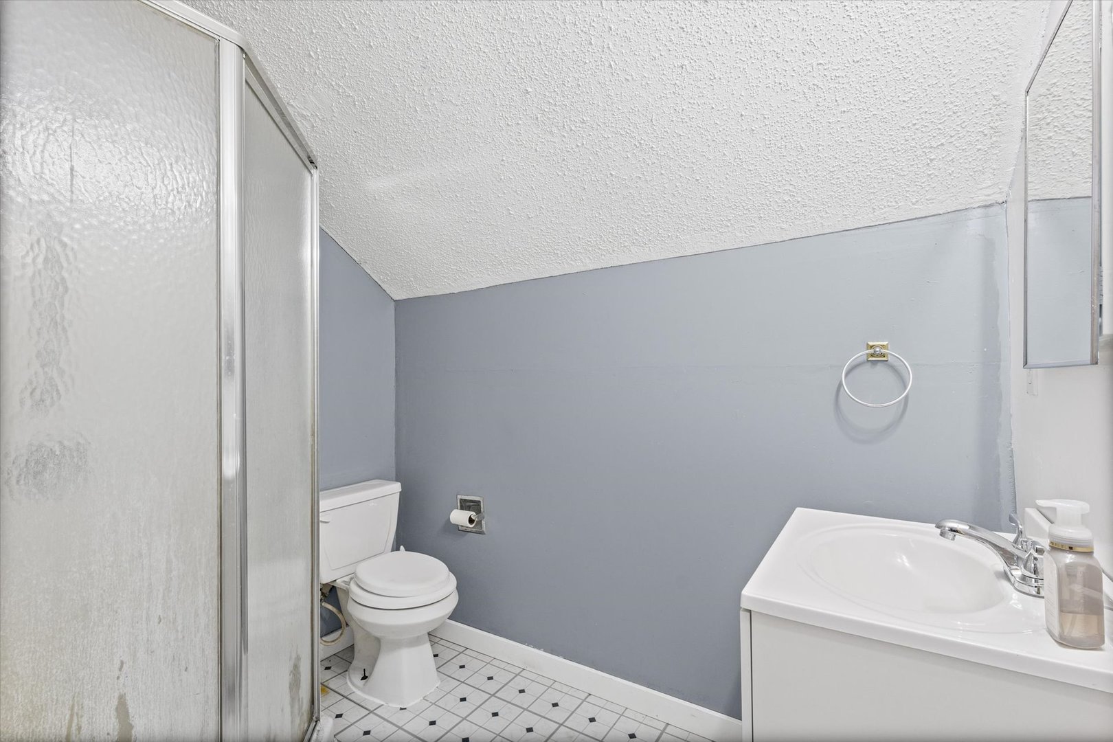 104 Allen Street Allerton, IL 61810 - Photo 27 of 33 a bathroom with a toilet a sink and a mirror