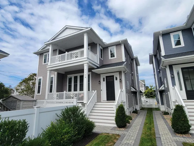 a view of a house with entrance gate