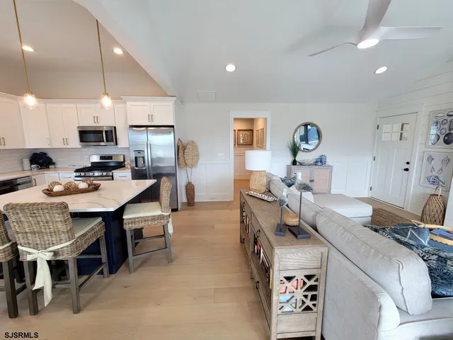 a kitchen that has a table and chairs in it