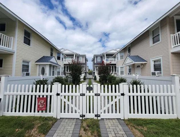 a view of a house with wooden deck