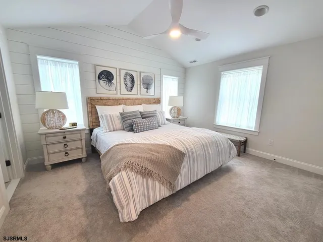 a bed room with a bed and a tv