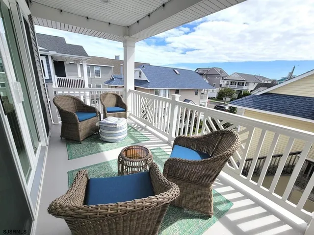 a view of balcony with furniture