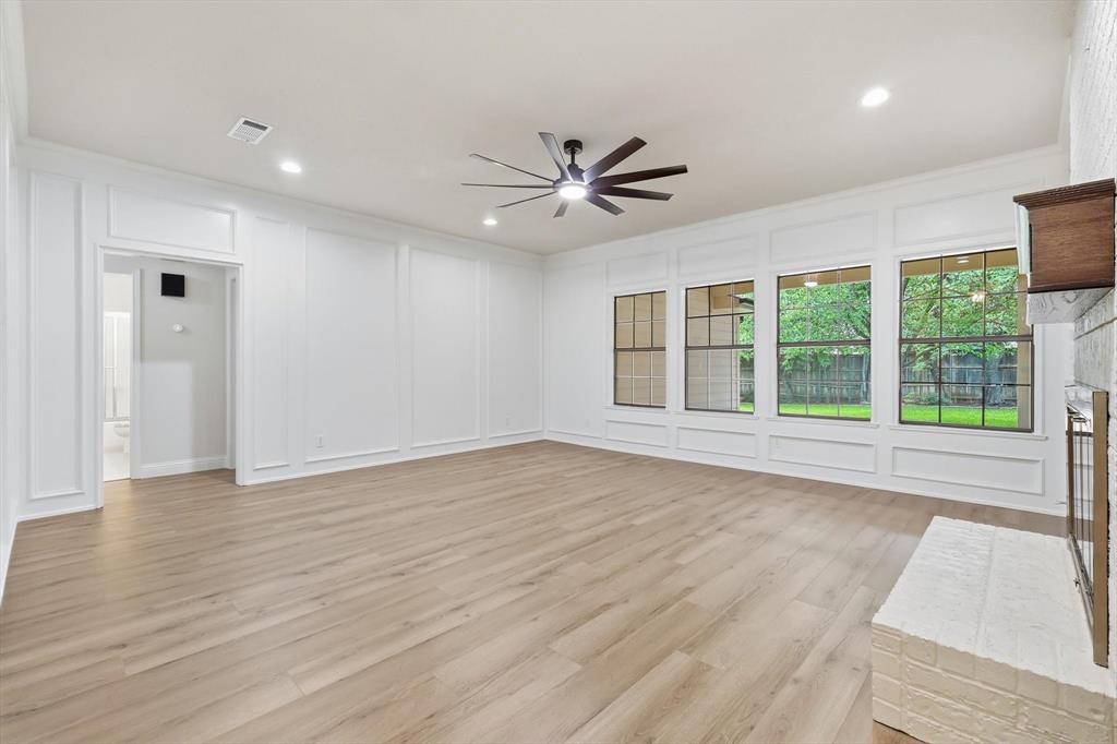 19 Timbergreen Circle Denton, TX 76205 - Photo 5 of 40 a view of an empty room with a window and wooden floor