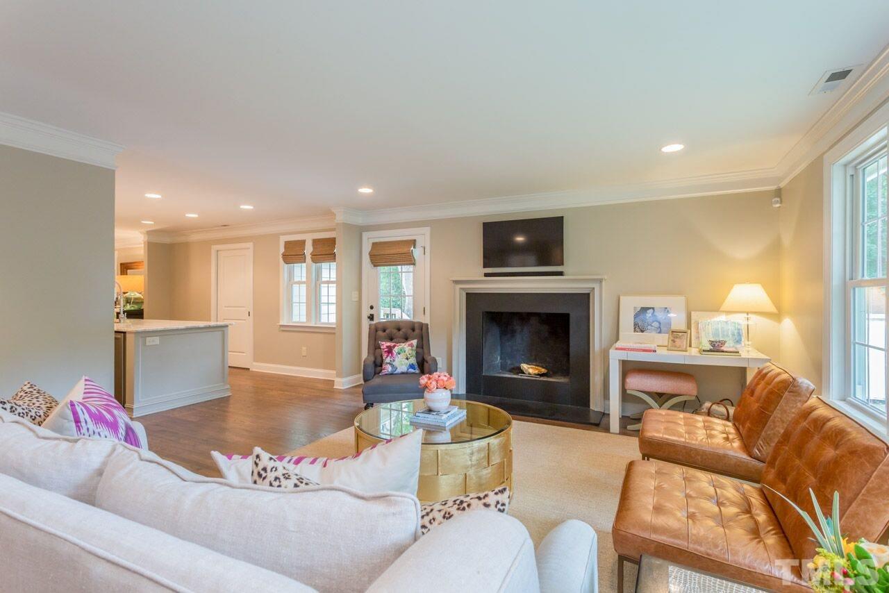 2818 Fowler Avenue Raleigh, NC 27607 - Photo 12 of 25 a living room with furniture and a fireplace