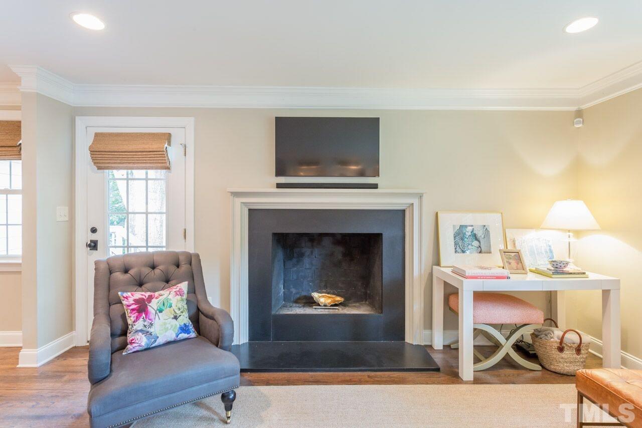 2818 Fowler Avenue Raleigh, NC 27607 - Photo 13 of 25 a living room with furniture and a fireplace