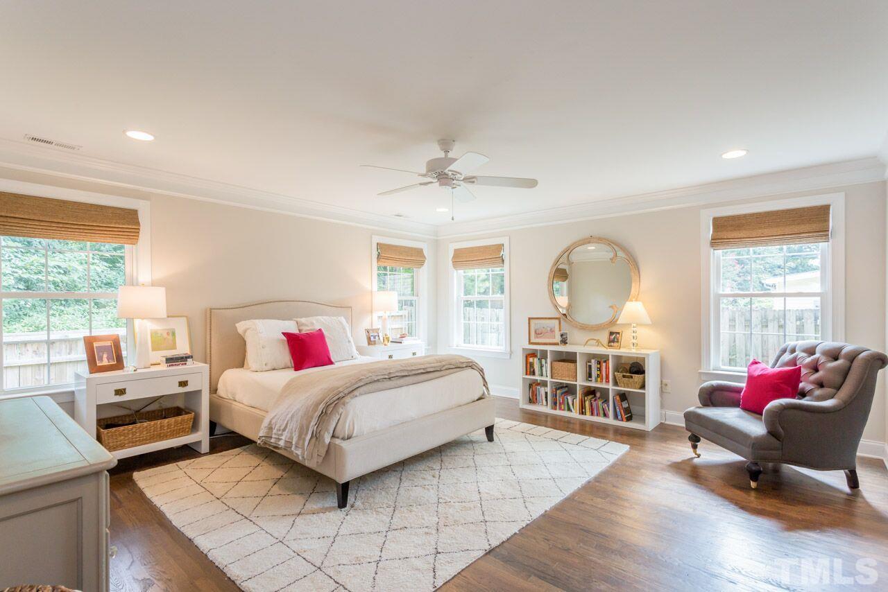 2818 Fowler Avenue Raleigh, NC 27607 - Photo 15 of 25 a living room with a bed furniture and a large window