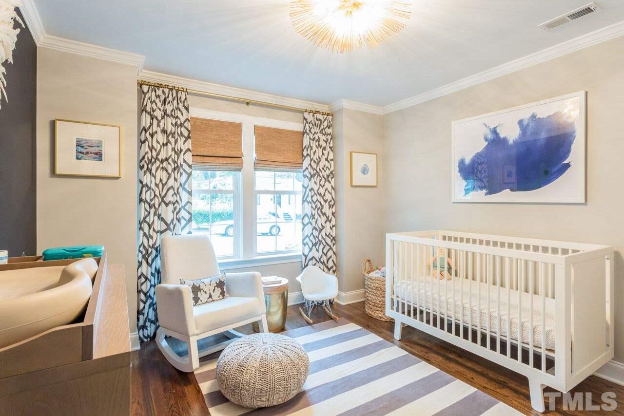 2818 Fowler Avenue Raleigh, NC 27607 - Photo 19 of 25 a bedroom with furniture and a large window