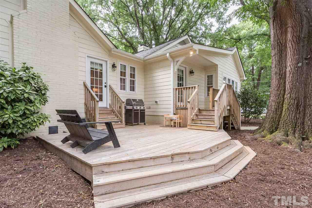 2818 Fowler Avenue Raleigh, NC 27607 - Photo 21 of 25 a front view of a house with a yard