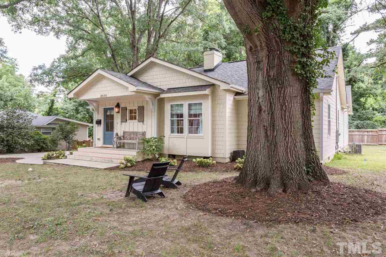 2818 Fowler Avenue Raleigh, NC 27607 - Photo 25 of 25 a view of a house with backyard and a tree