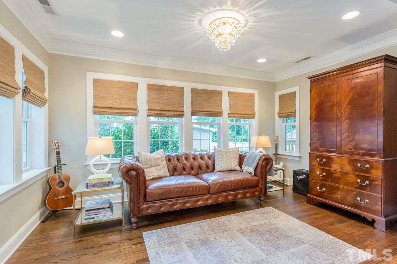 2818 Fowler Avenue Raleigh, NC 27607 - Photo 5 of 25 a living room with furniture and a large window