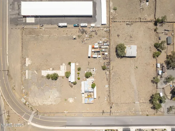 an aerial view of beach and building