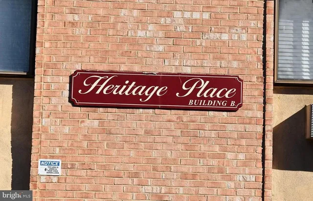 a sign broad on brick wall