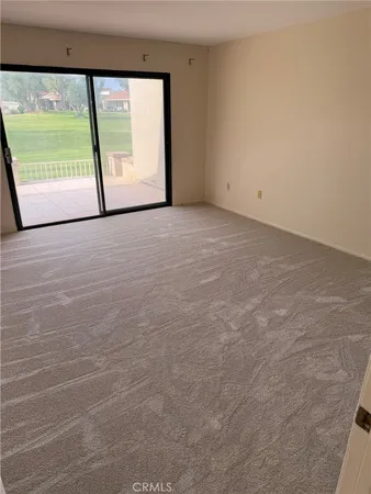 an empty room with a bench