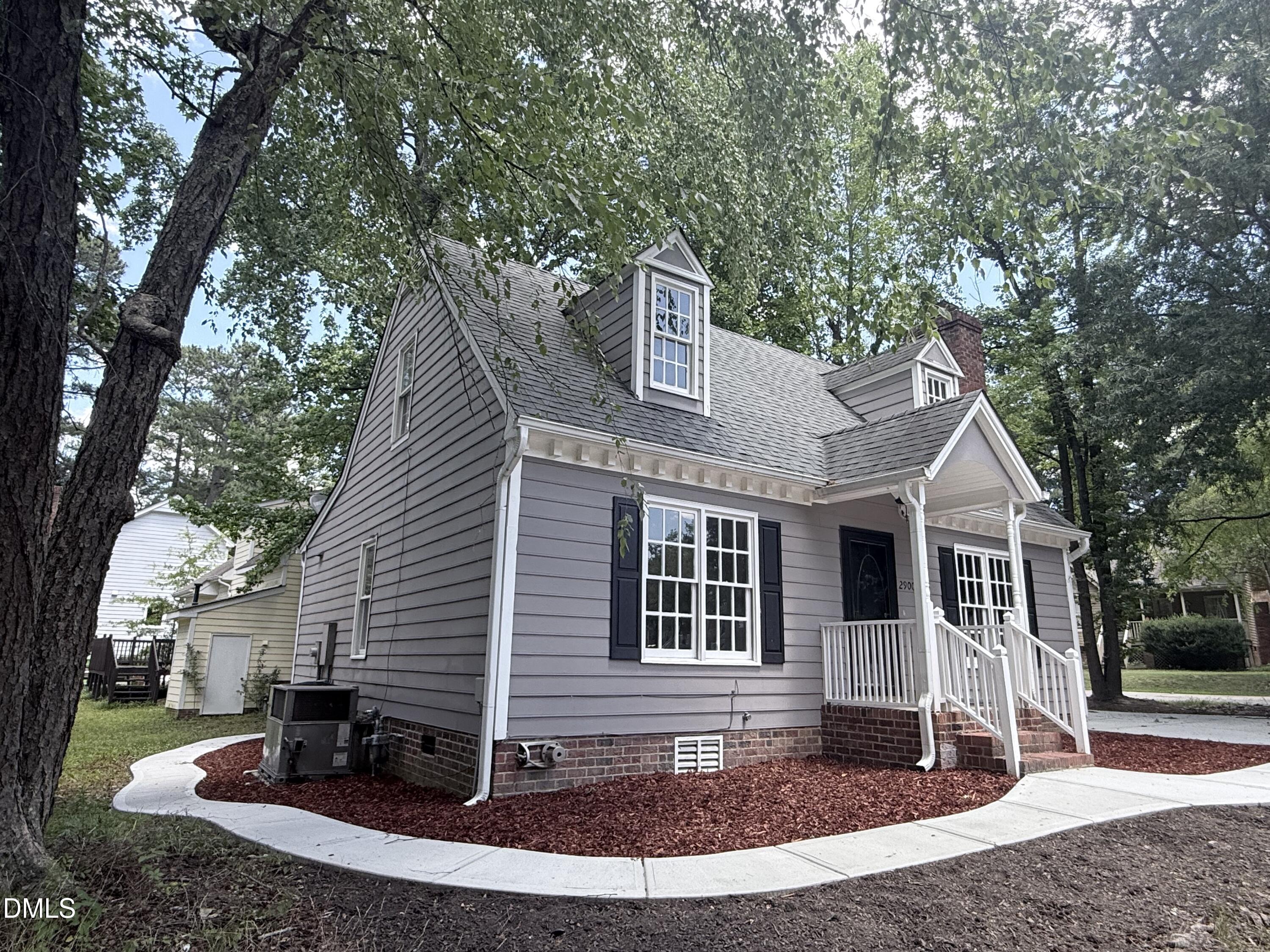 2900 Broadlands Drive Raleigh, NC 27604 - Photo 5 of 60 a front view of a house with garden