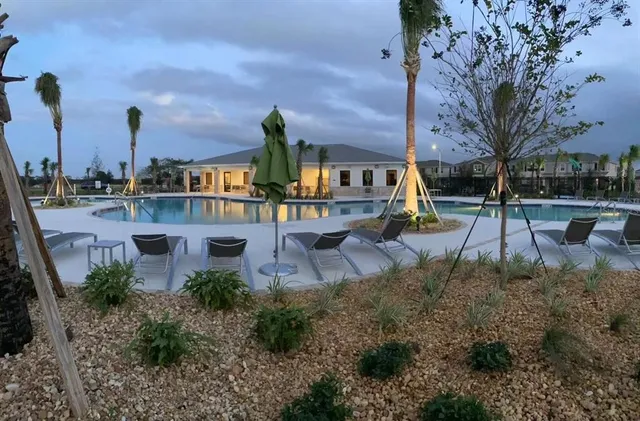 a view of a park with plants and bench