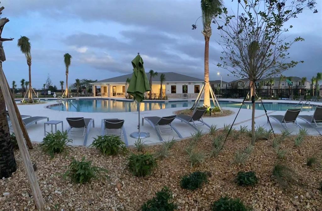 16147 Water Spring Boulevard Winter Garden, FL 34787 - Photo 17 of 17 a view of a park with plants and bench
