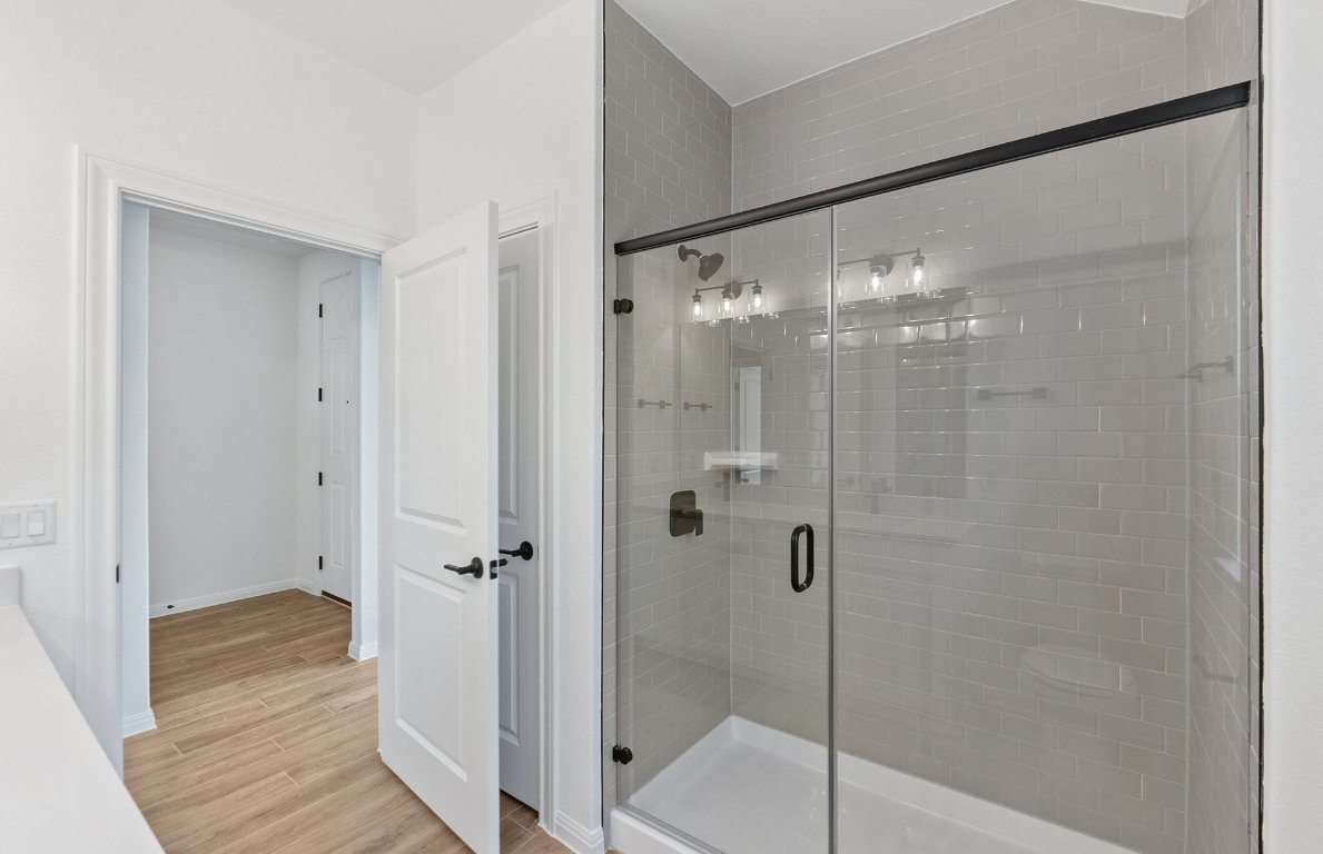 808 Crescent View Drive Georgetown, TX 78628 - Photo 13 of 19 a bathroom with a glass shower door