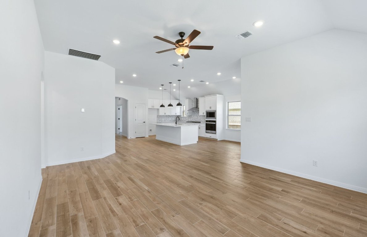 808 Crescent View Drive Georgetown, TX 78628 - Photo 4 of 19 a view of empty room with wooden floor
