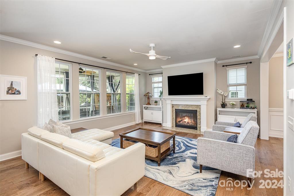 1040 Emory Lane Fort Mill, SC 29708 - Photo 13 of 48 a living room with furniture a fireplace and a flat screen tv
