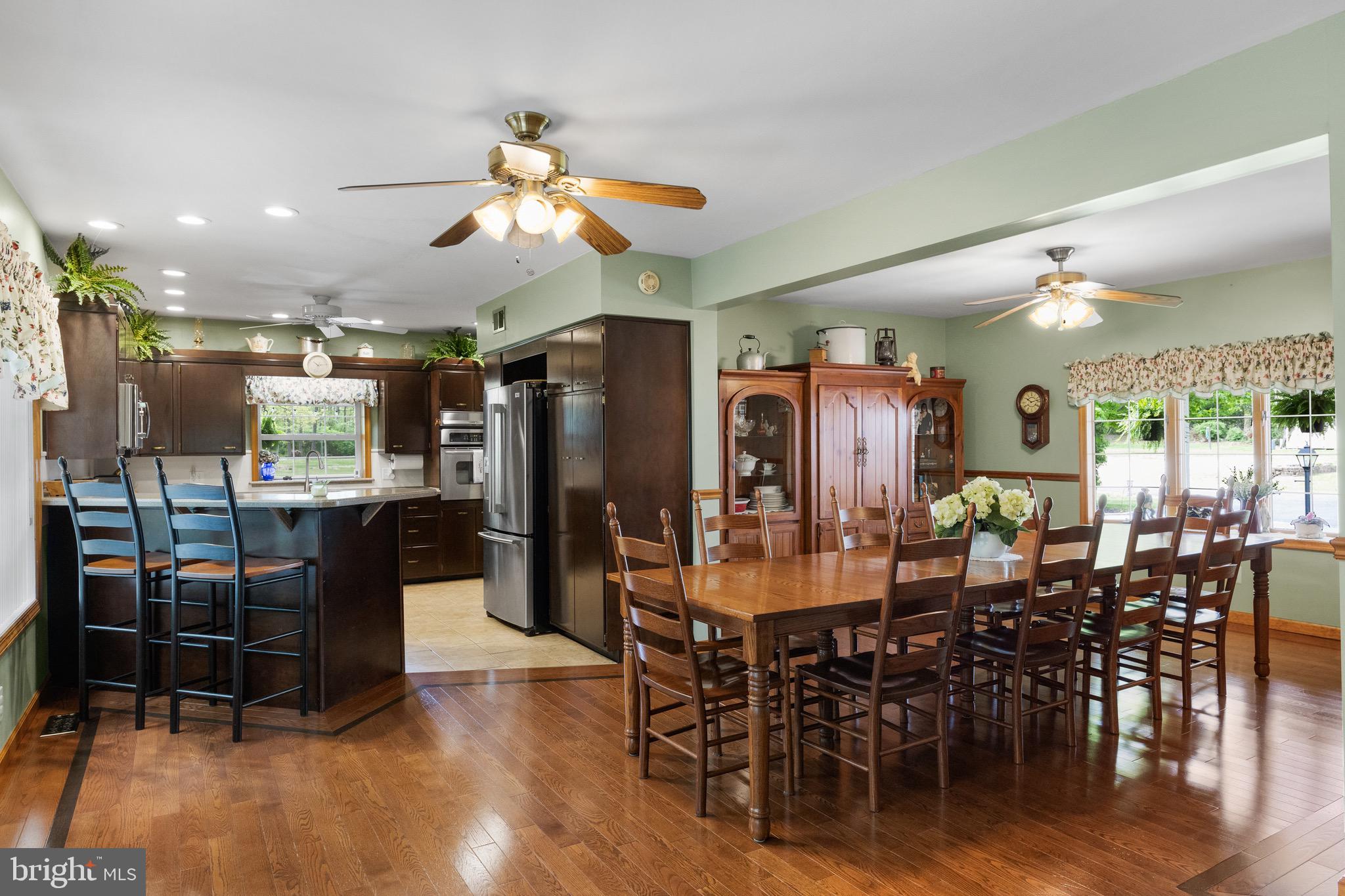 10 Cedar Brook Road Sicklerville, NJ 08081 - Photo 12 of 52 a view of a dining area with furniture and wooden floor