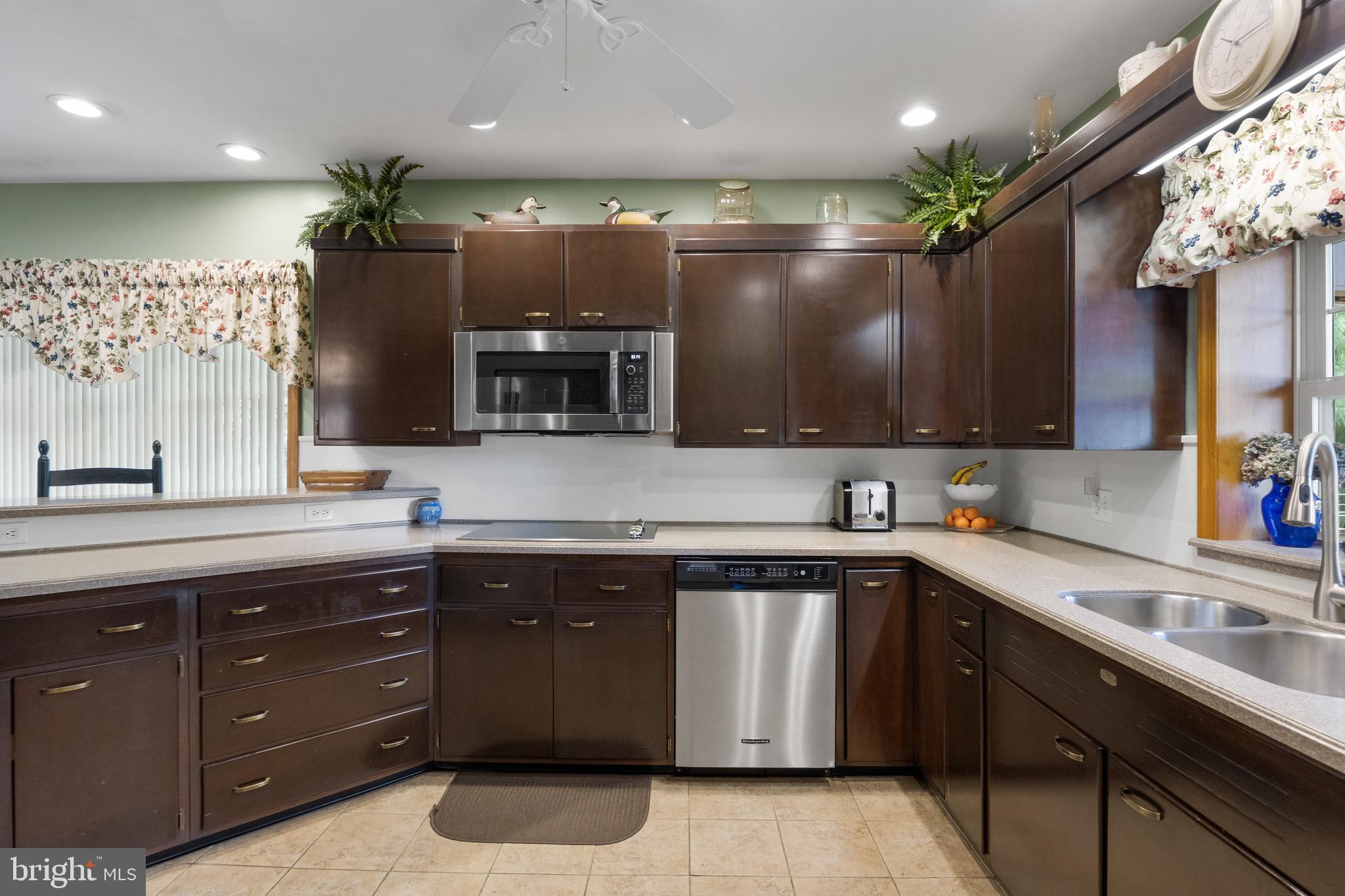 10 Cedar Brook Road Sicklerville, NJ 08081 - Photo 14 of 52 a kitchen with a sink and cabinets