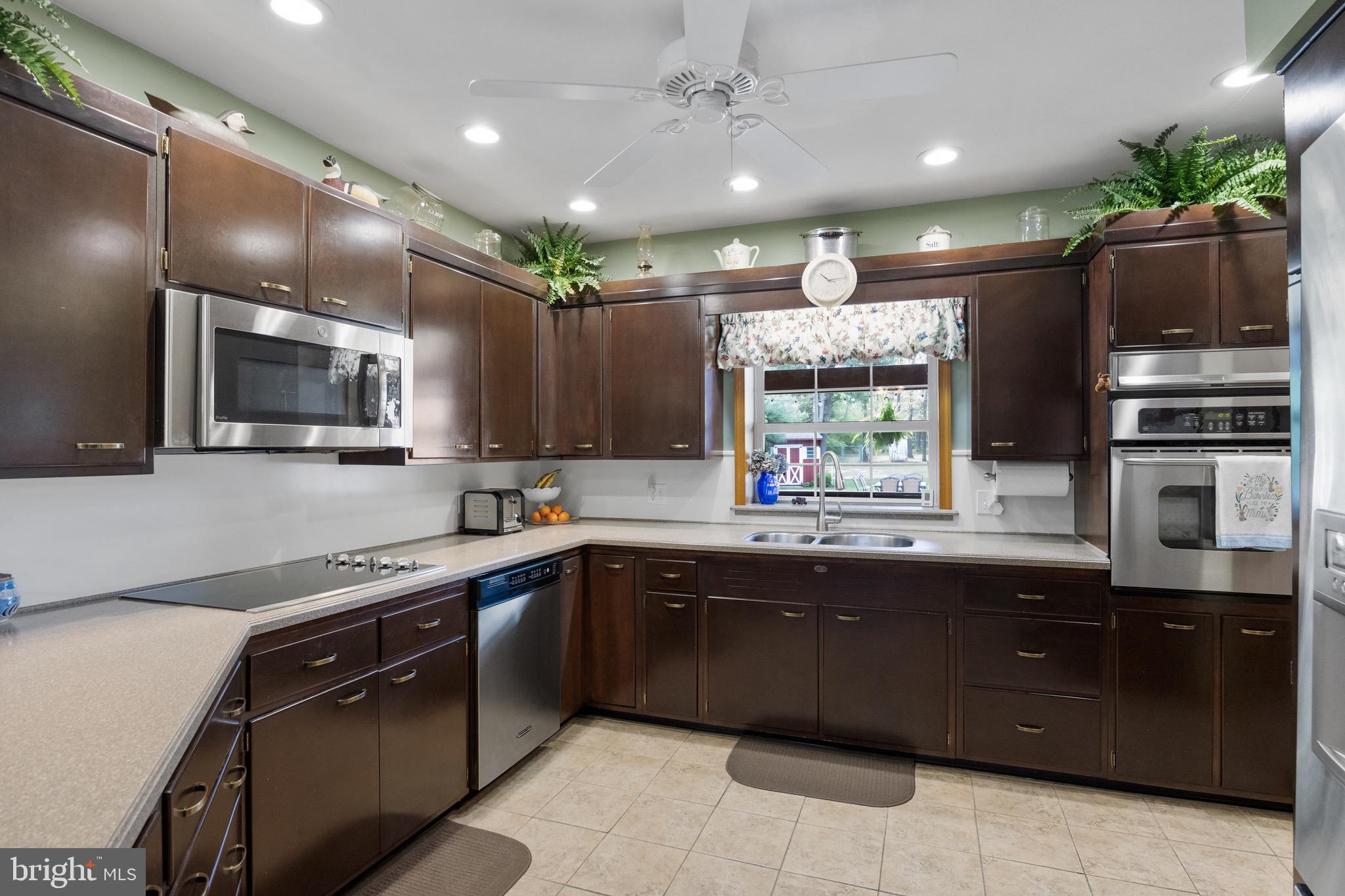 10 Cedar Brook Road Sicklerville, NJ 08081 - Photo 15 of 52 a large kitchen with a sink and stainless steel appliances