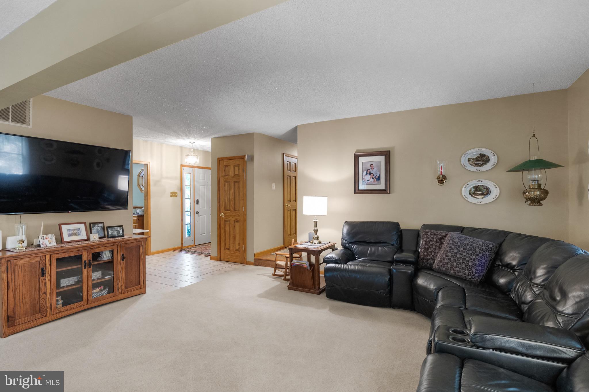 10 Cedar Brook Road Sicklerville, NJ 08081 - Photo 17 of 52 a living room with furniture and a flat screen tv