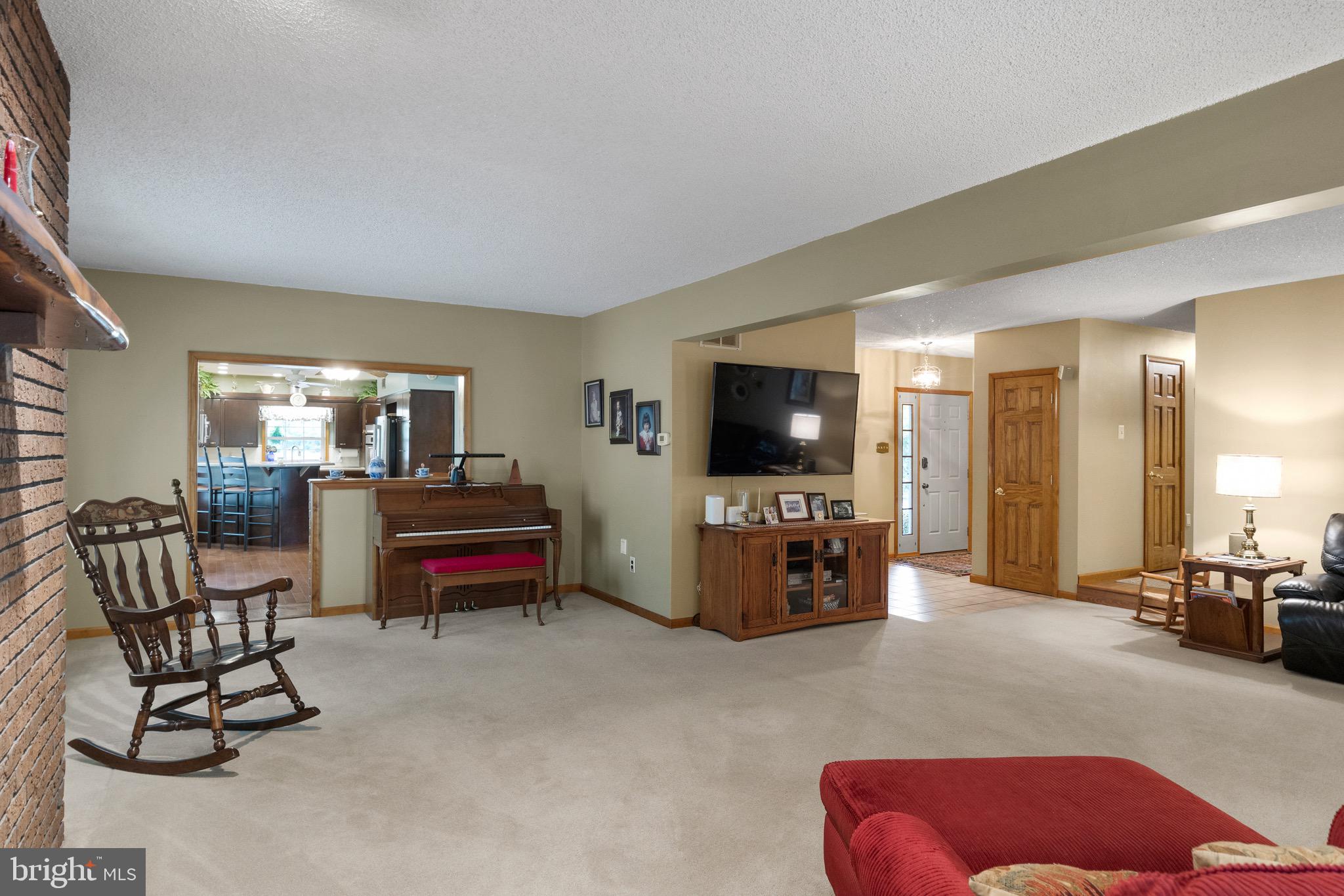 10 Cedar Brook Road Sicklerville, NJ 08081 - Photo 18 of 52 a living room with furniture and a flat screen tv
