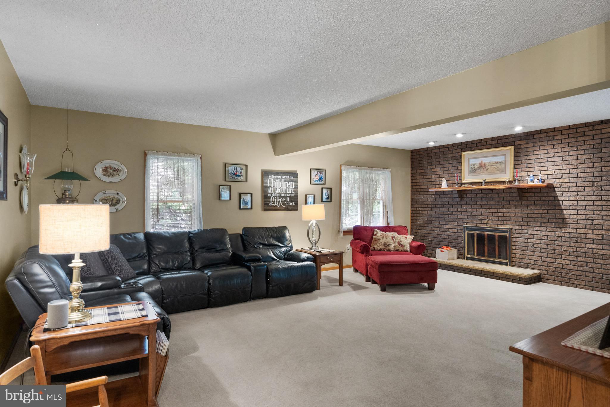 10 Cedar Brook Road Sicklerville, NJ 08081 - Photo 20 of 52 a living room with furniture window and a fireplace