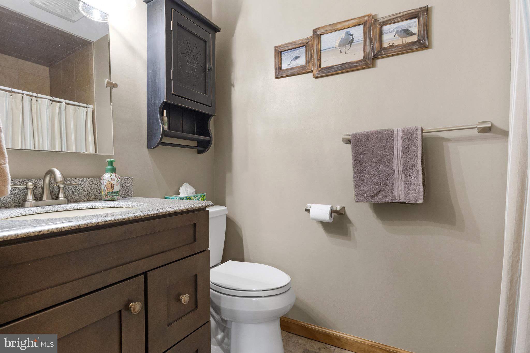 10 Cedar Brook Road Sicklerville, NJ 08081 - Photo 24 of 52 a bathroom with a granite countertop sink mirror vanity and toilet