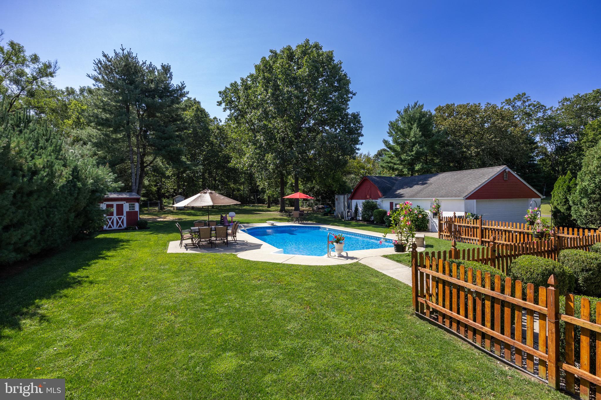 10 Cedar Brook Road Sicklerville, NJ 08081 - Photo 42 of 52 a view of a house with swimming pool and sitting area