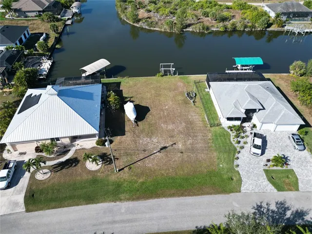 an aerial view of a house with yard swimming pool and outdoor seating