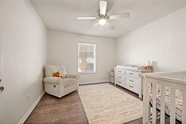 a bed room with a bed and a window