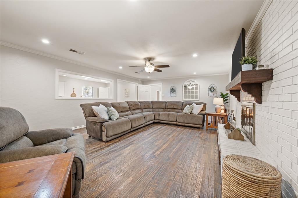 101 Ranch Road Krugerville, TX 76227 - Photo 15 of 39 a living room with furniture and a wooden floor
