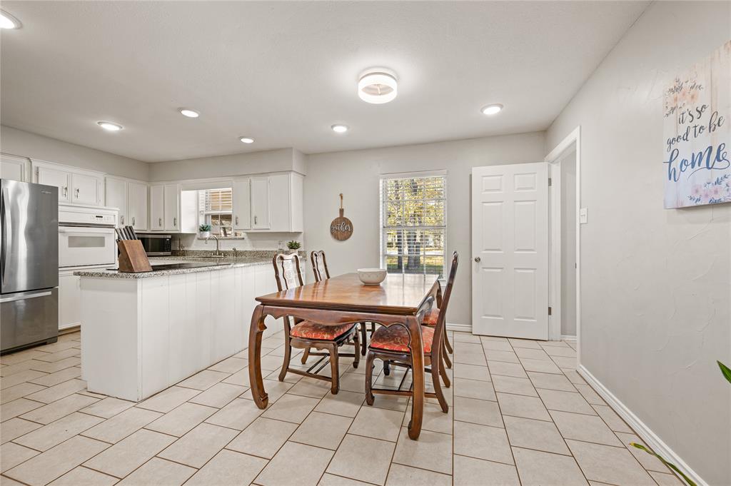 101 Ranch Road Krugerville, TX 76227 - Photo 17 of 39 a kitchen with stainless steel appliances a refrigerator and a stove top oven