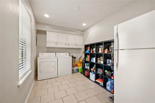 a storage room with washer and dryer