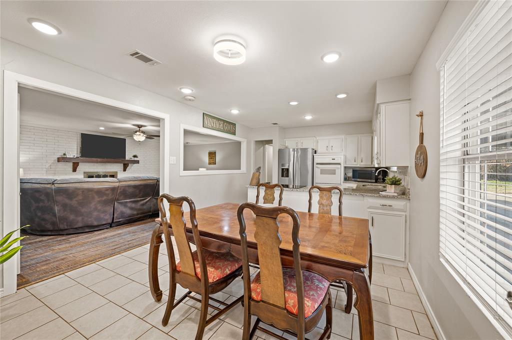 101 Ranch Road Krugerville, TX 76227 - Photo 19 of 39 a large kitchen with a table and chairs in it