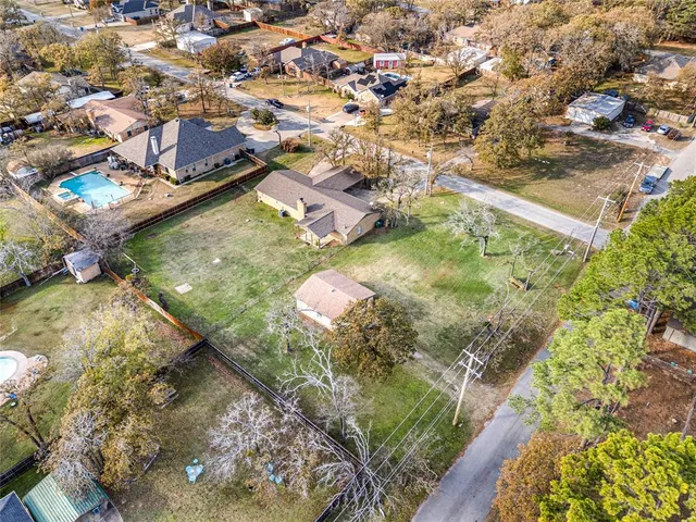 a aerial view of a house with a yard