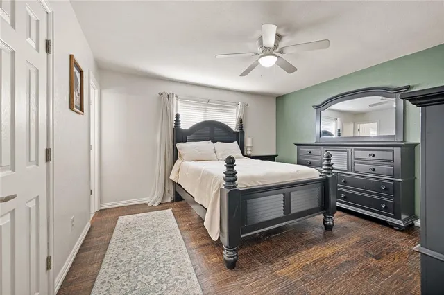 a bedroom with a bed and a dresser