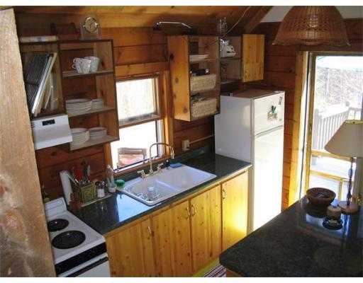 84 Moores Road Florida, MA 01343 - Photo 5 of 13 a kitchen with a stove and a refrigerator